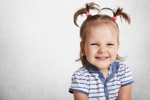 Placowkowo | cheerful positive adorable small child with two pony tails